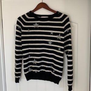 Black and White Striped Sweater with Star Accents